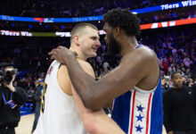 Jokic and nuggets hold off embiid less 76ers
