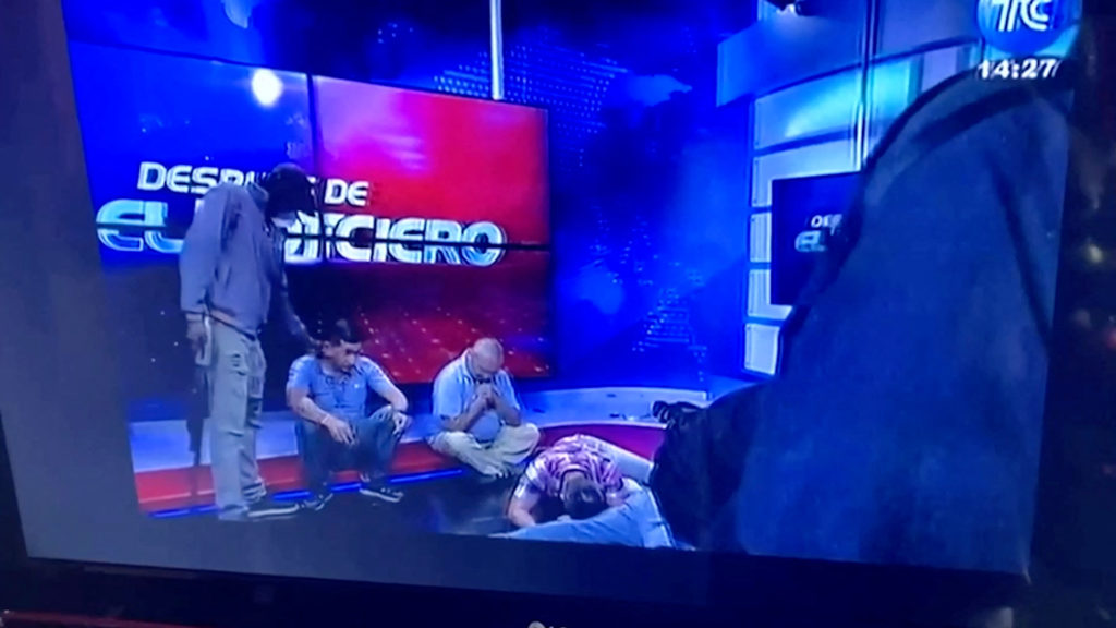 Ecuador s escalating gang violence is broadcast live as masked gunmen storm tv studio