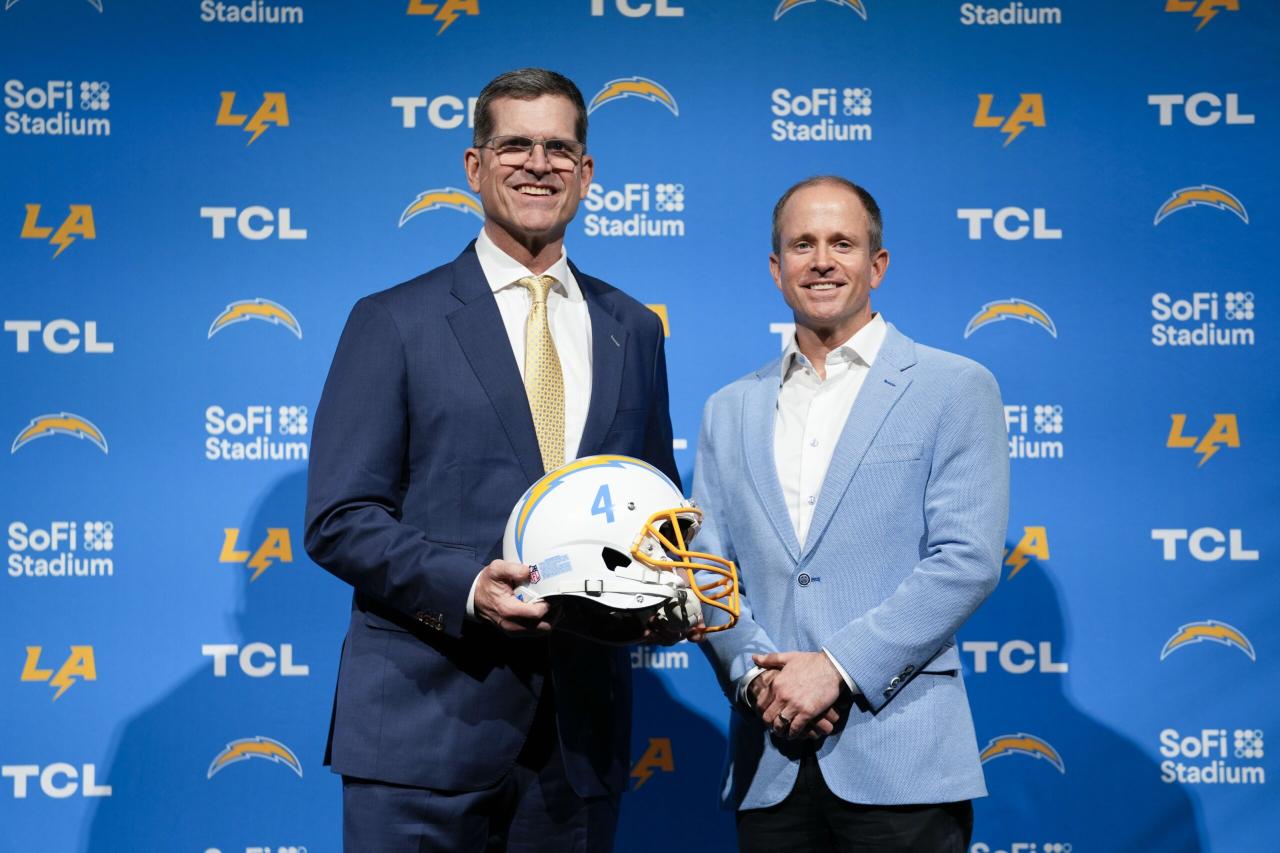 Chargers hire jim harbaugh after college triumph