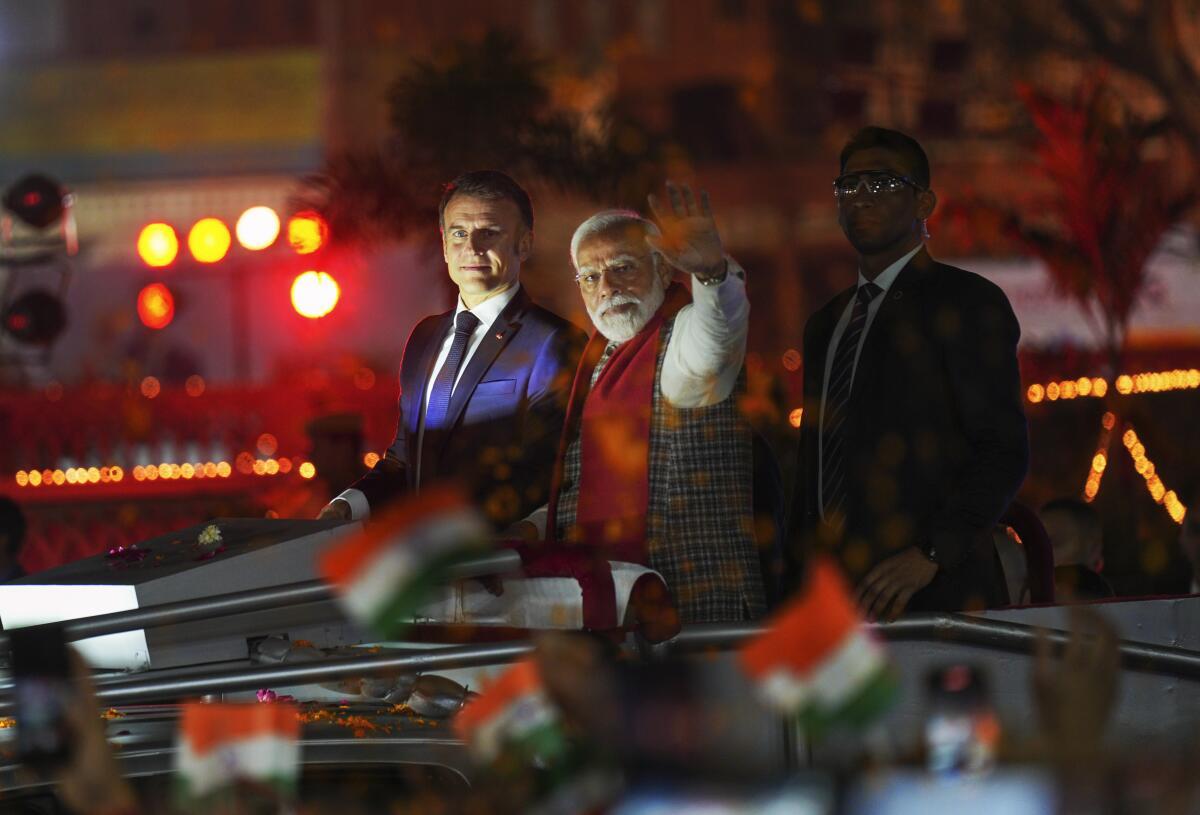 India fetes france s macron at annual military parade