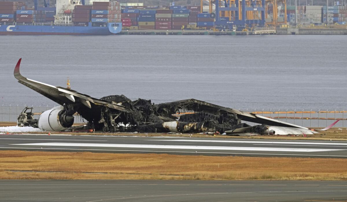 Japanese airliner burns after apparent collision with coast guard aircraft at tokyo s haneda airport