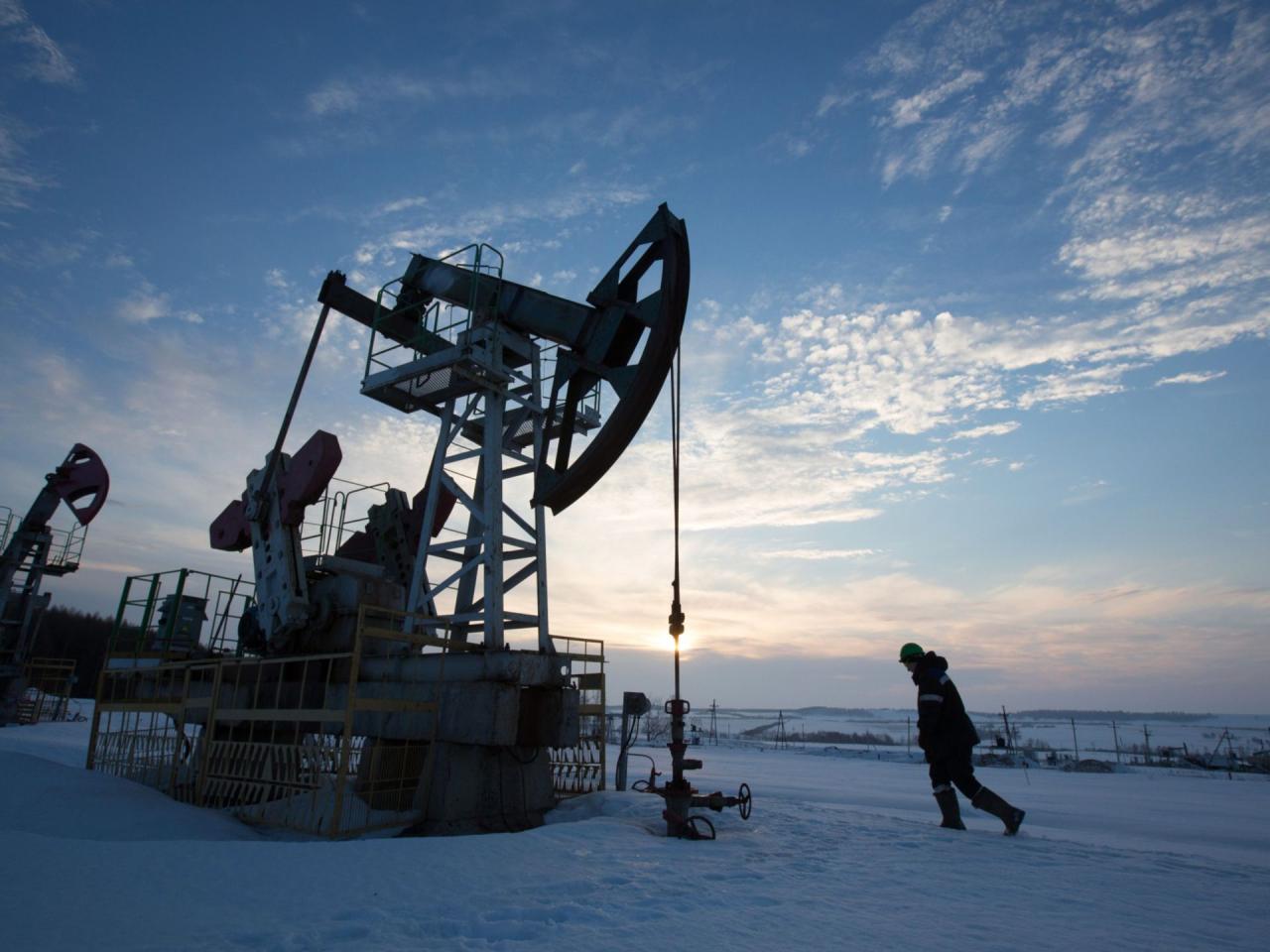 Lower profits at us oil giants still mighty enough for big investor payouts