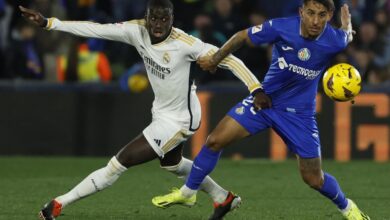 Joselu double sends madrid top at getafe